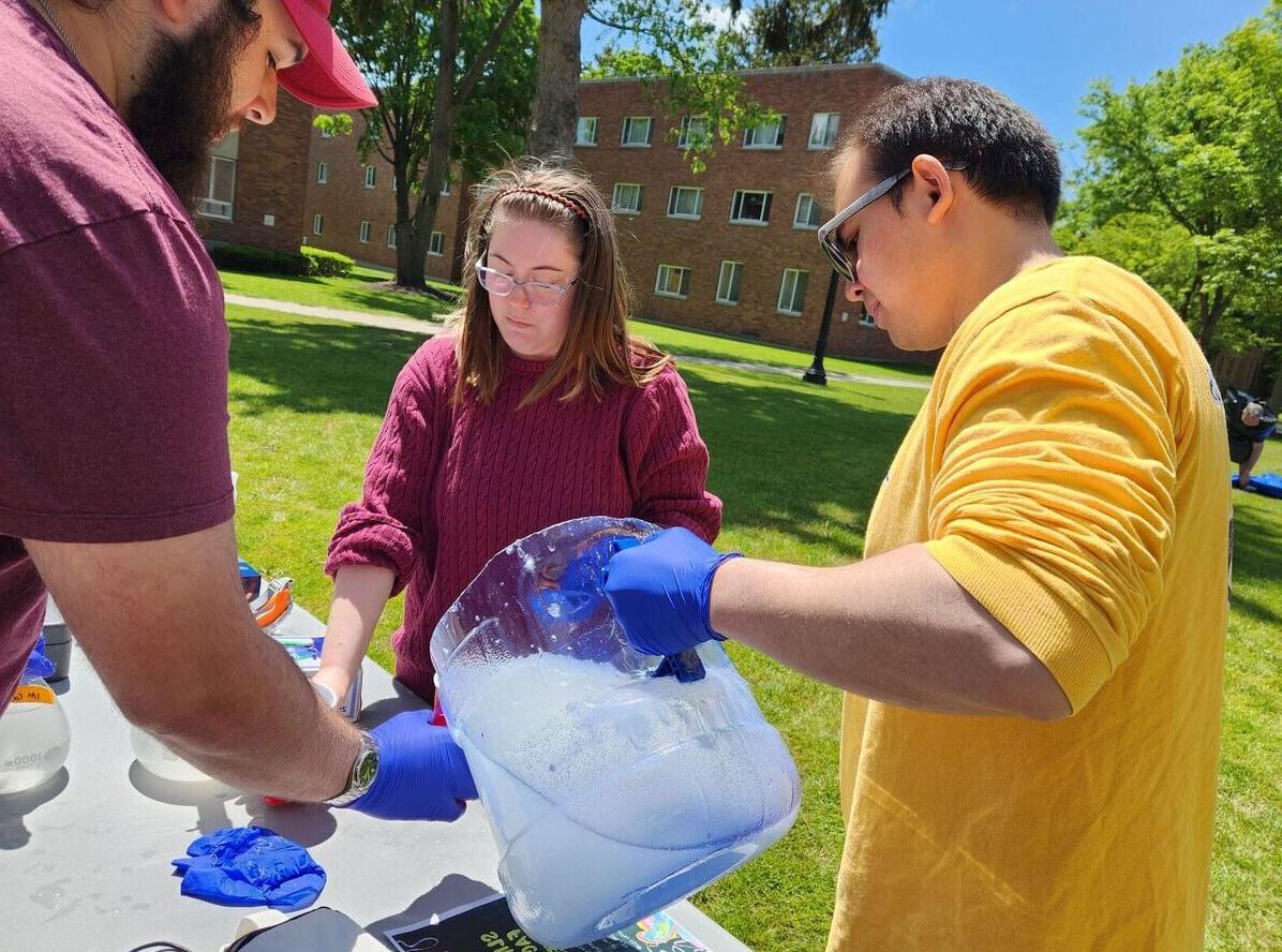 Chemistry Club members mix up slime during the Slime the Faculty event
